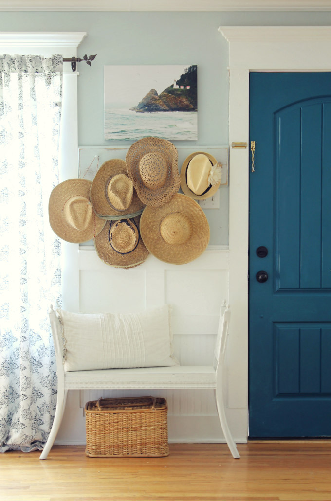Cottage home tour - love the collection of hats kellyelko.com