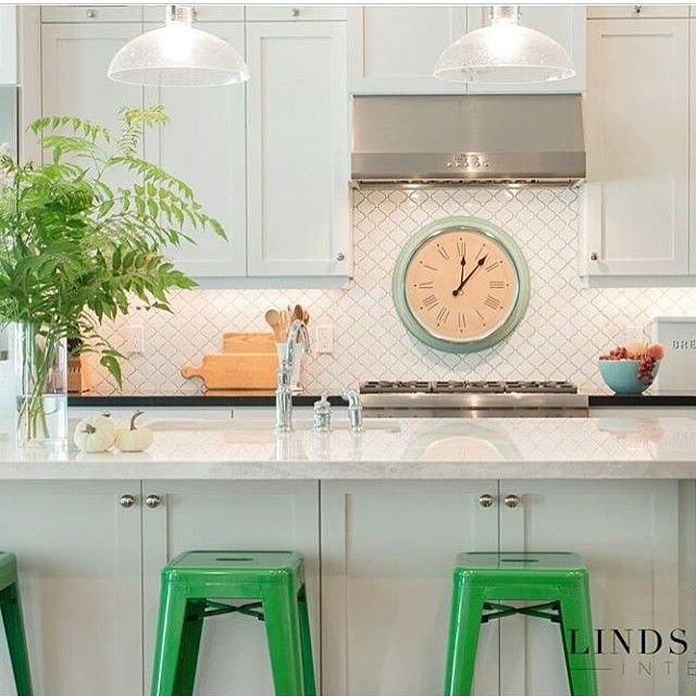 Love a white kitchen with a pop of fun color - the green barstools are such a great choice kellyelko.com