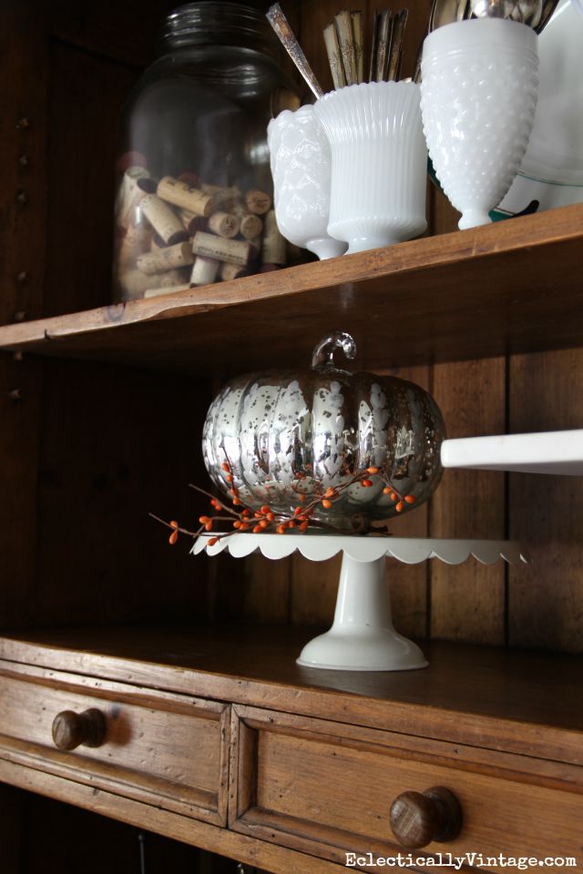 Mercury glass pumpkin looks cute in a dining room hutch kellyelko.com