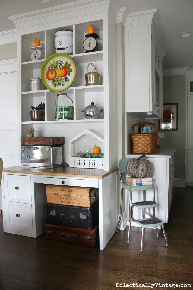 Open shelf styling for fall - love the vintage platter hung in front kellyelko.com