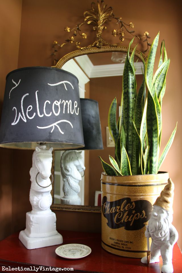 Love the mix of antique and vintage finds - the old Charles Chips container is such a fun planter kellyelko.com