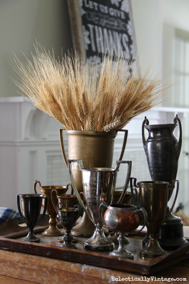 Vintage trophies filled with wheat for fall kellyelko.com