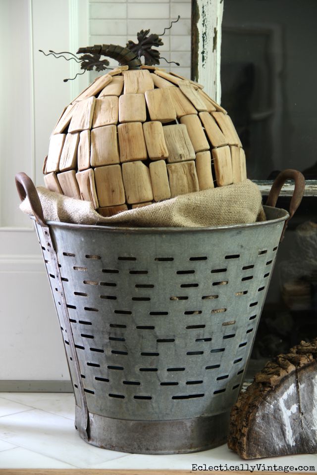 Vintage olive bucket with driftwood pumpkin for fall kellyelko.com