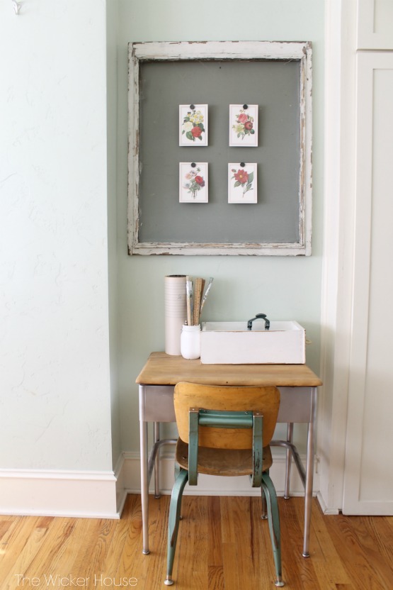 Cute little vintage school desk and love the old screen window used to display art 