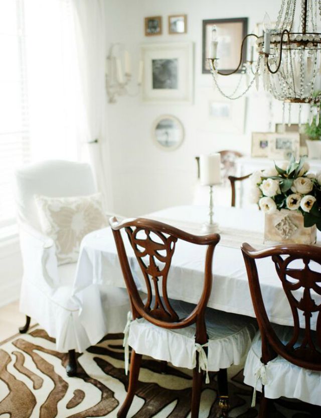 White dining room with zebra rug kellyelko.com