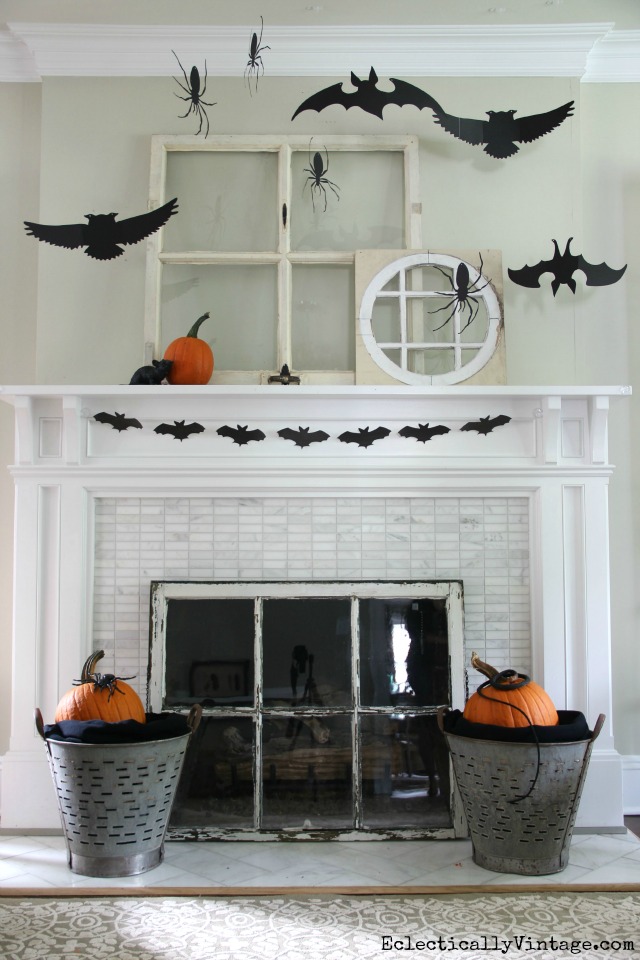 Love this silhouette Halloween mantel with vintage windows and the DIY bat banner printable kellyelko.com