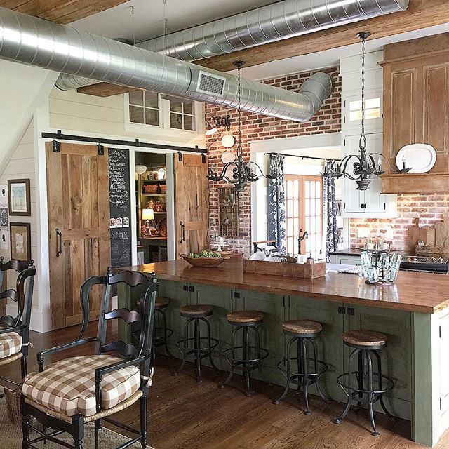 Love this farmhouse kitchen with exposed duct work and brick walls - part of this farmhouse tour kellyelko.com