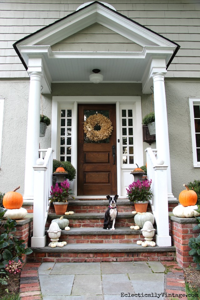 Love this natural fall porch - look at the stacked pumpkins! kellyelko.com