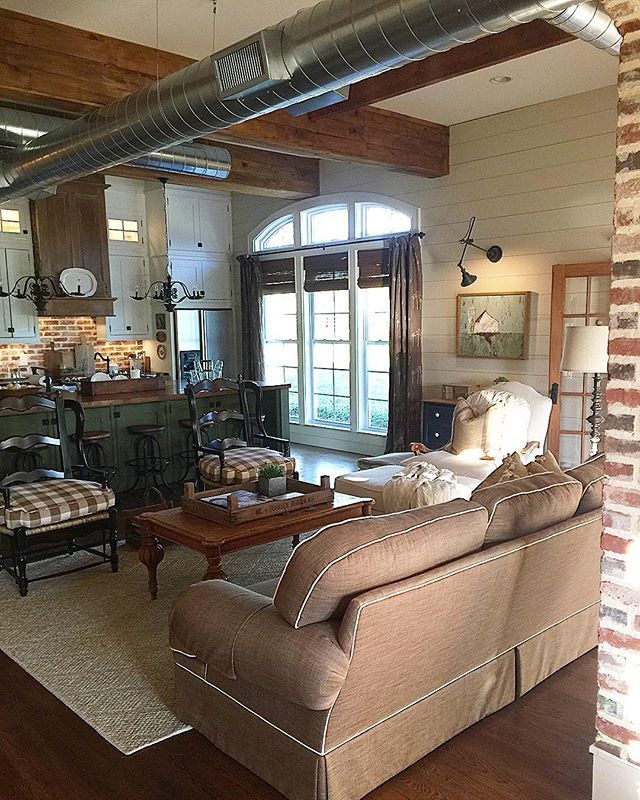 Farmhouse family room - love the exposed duct work and the 100 year old beams made from old barn floors kellyelko.com