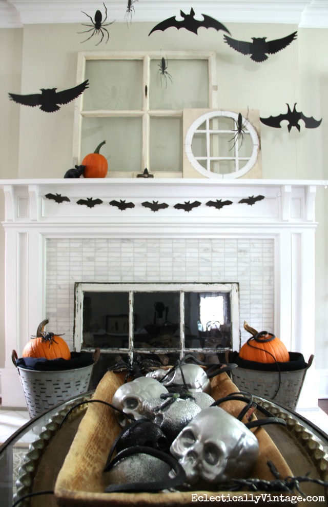 Love this black and white Halloween mantel and that big dough bowl of skulls! kellyelko.com