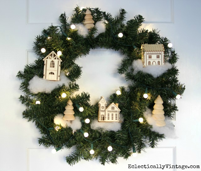 Make this DIY Christmas village wreath - such great tips and instructions for making your own kellyelko.com