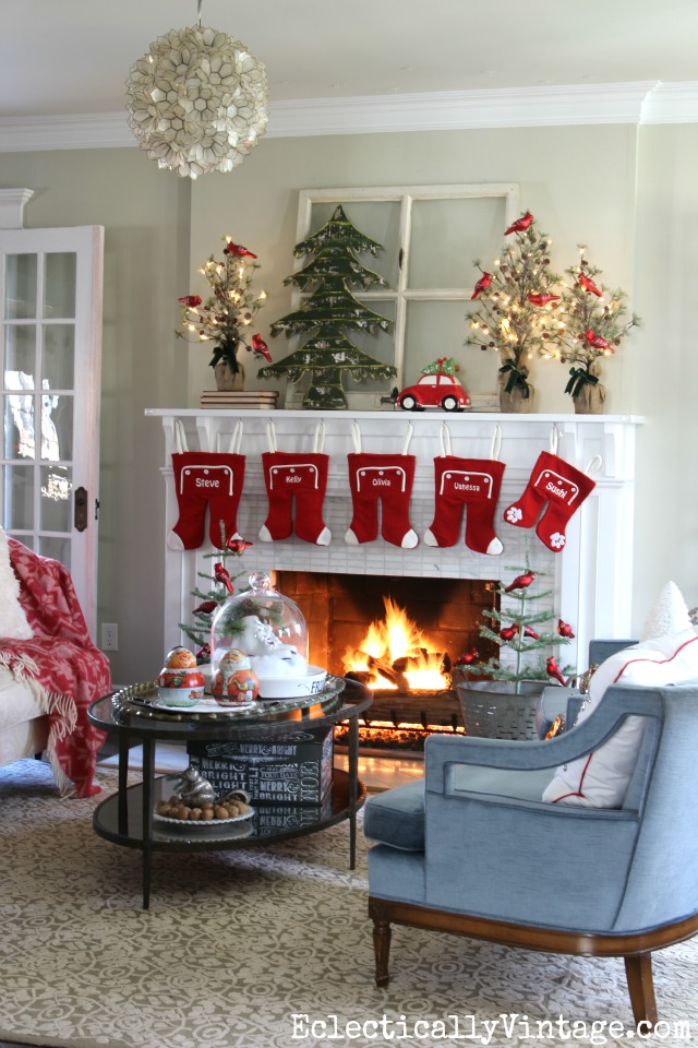 Love this festive Christmas mantel and the whimsical long john stockings kellyelko.com