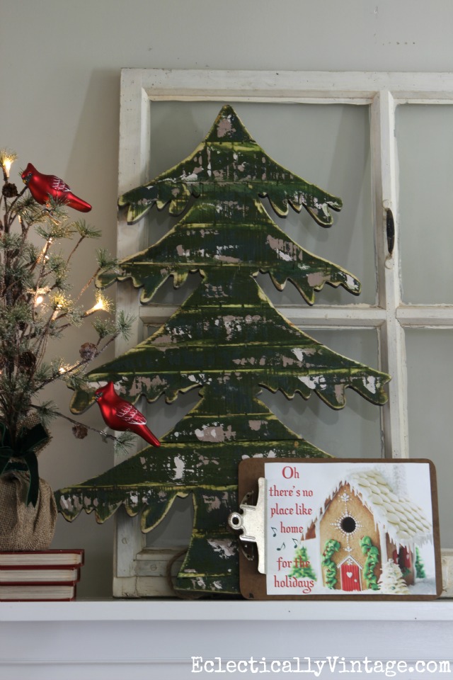 Love this mantel with the wood spruce tree and the FREE gingerbread house printable kellyelko.com