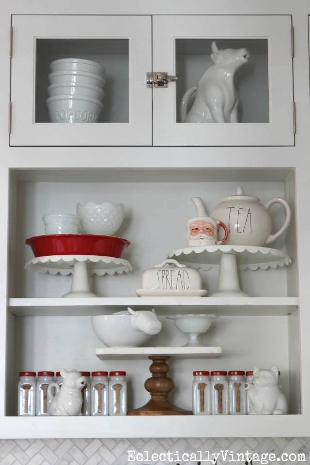 Christmas kitchen shelves - love the cake stand collection and the touches of red kellyelko.com