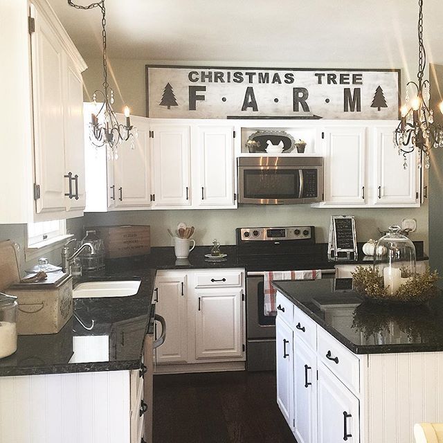 Love this white kitchen and the DIY Christmas Tree Farm sign 