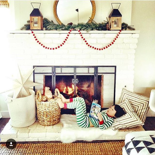 Love this minimal Christmas mantel and the pom pom garland