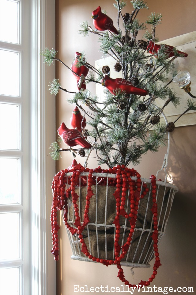 Love the tree in the metal basket and the flock of red cardinal ornaments for Christmas kellyelko.com