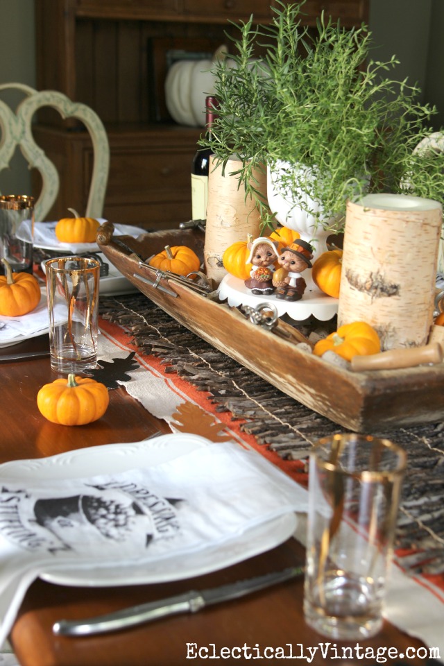 Thanksgiving Tablescapes - love this vintage dough bowl filled with corks and vintage corkscrews! Plus see 25 more creative fall tables kellyelko.com