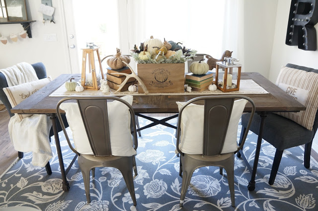 Love the floral rug in this cozy dining room kellyelko.com