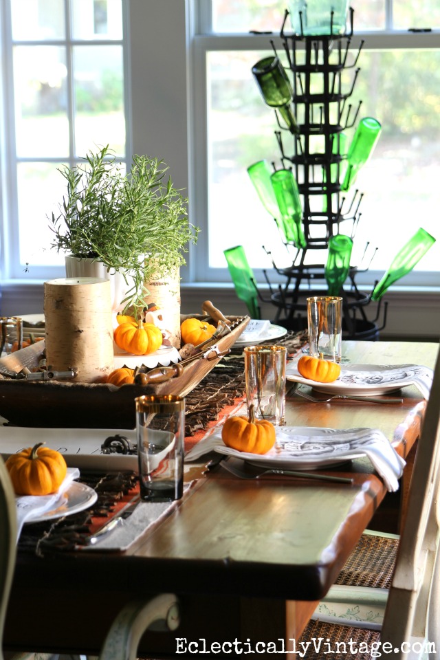 Fall tablescape - love the dough bowl centerpiece and the mini orange pumpkins kellyelko.com