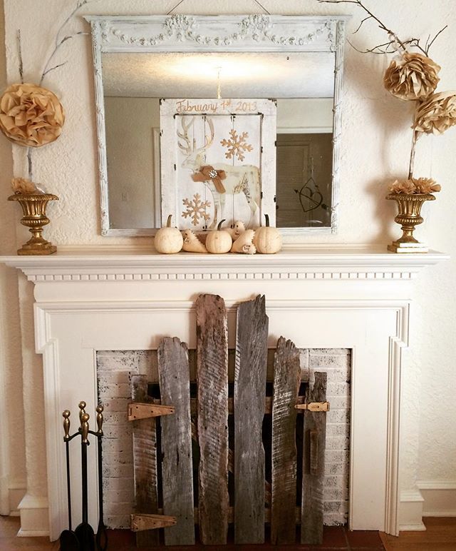 Love the old fence used as a fireplace screen!