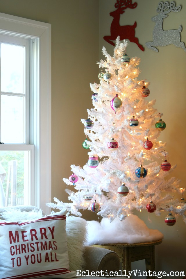 Love the flocked white Christmas tree with vintage ornaments kellyelko.com