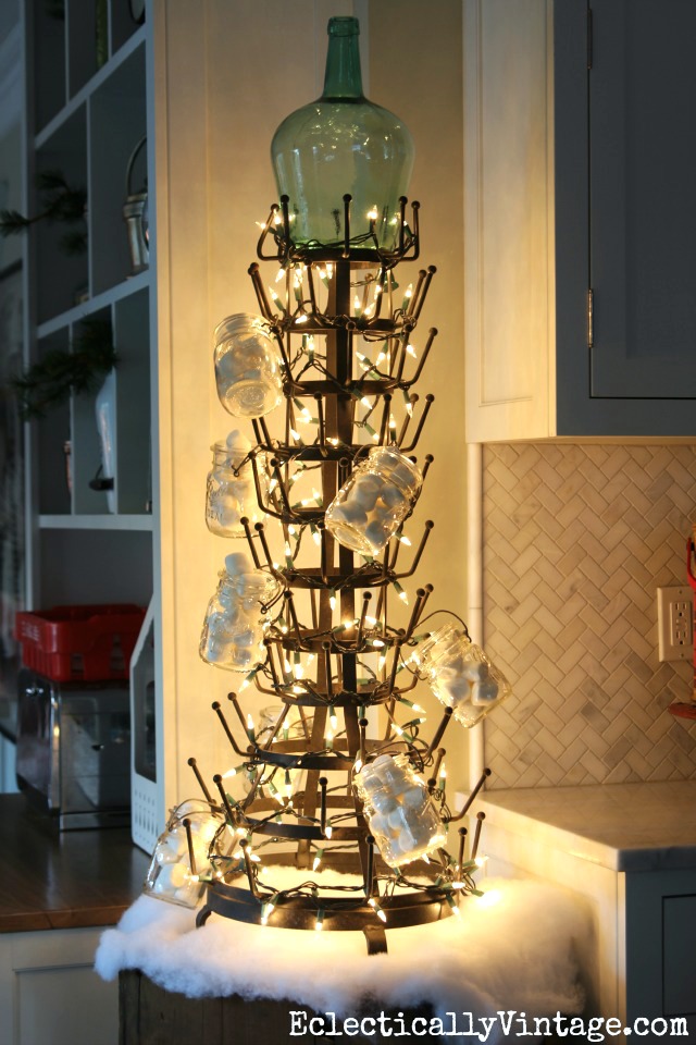 What a fun idea for a kitchen Christmas tree! String some lights around a huge bottle drying rack! kellyelko.com