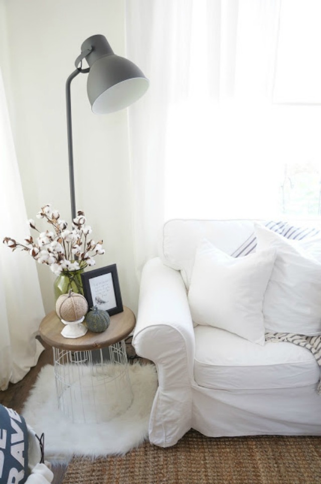 Love the industrial floor lamp and the white sofas kellyelko.com