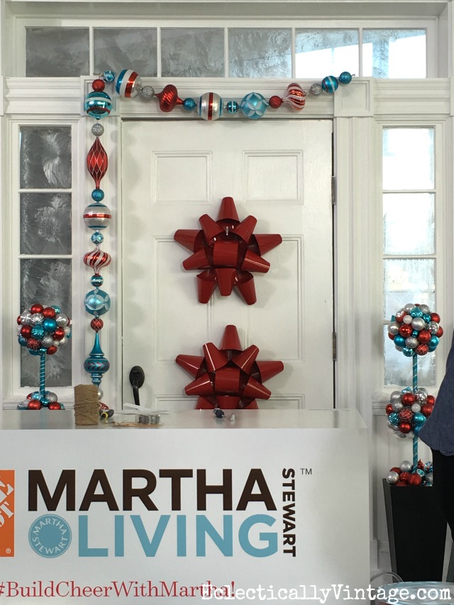 Use a giant red metal bow in place of a Christmas wreath on the front door! kellyelko.com