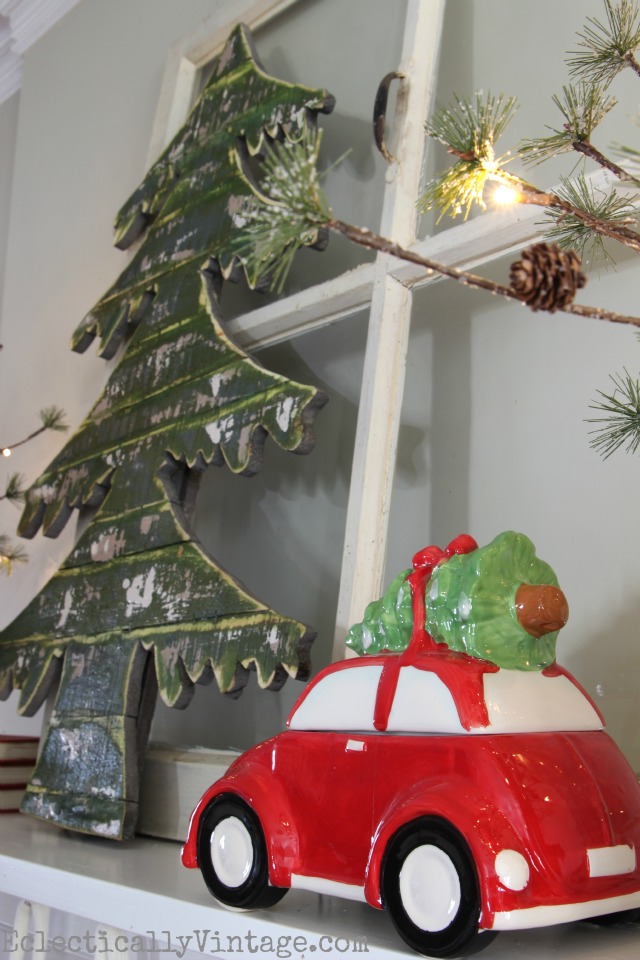 Red car hauling a tree - what a fun Christmas mantel! kellyelko.com