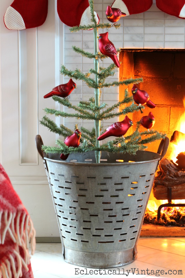 Vintage olive bucket with Christmas tree - love the red cardinal ornaments kellyelko.com