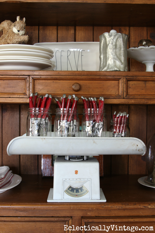 Vintage baby scale make a fun tray for holding cutlery in the dining room kellyelko.com