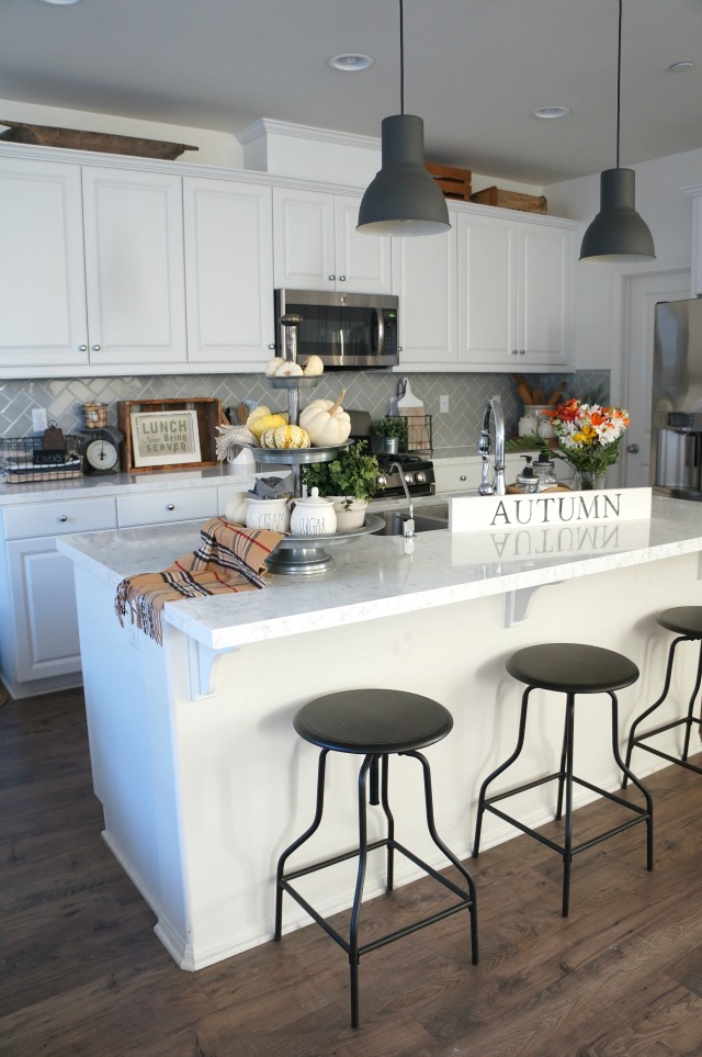 Eclectic Home Tour - love the industrial touches in this white kitchen. So many affordable decorating ideas kellyelko.com