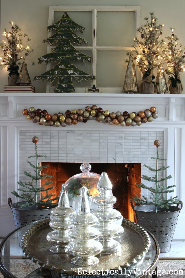 See how to make this festive ornament garland for your Christmas mantel kellyelko.com