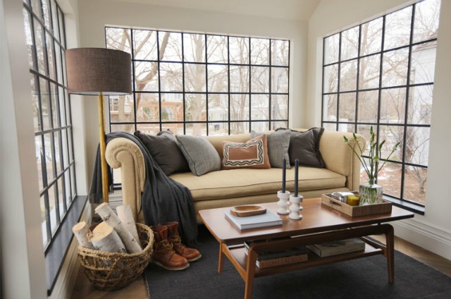 Love the black window mullions in this cozy sunroom kellyelko.com