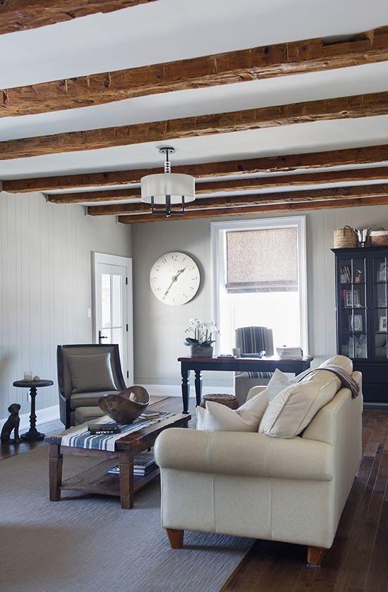 Rustic wood beams in this farmhouse family room kellyelko.com