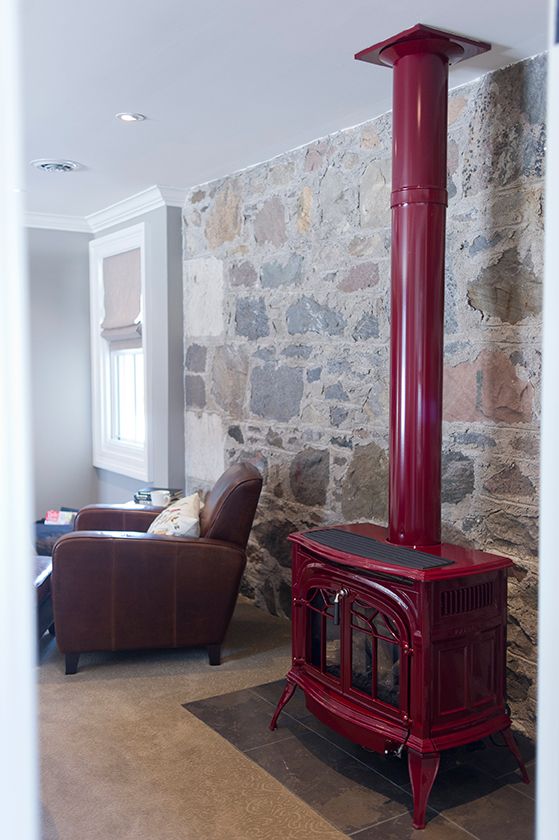 Charming red wood burning stove in this stone walled farmhouse kellyelko.com