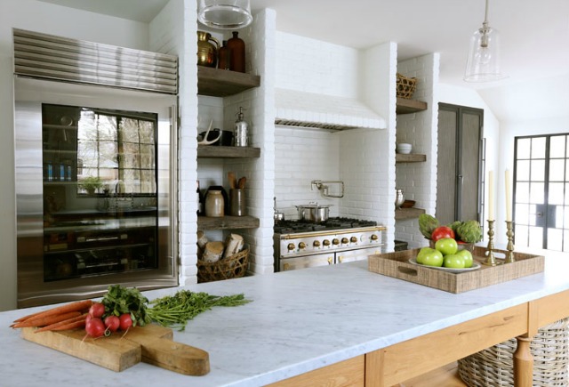 This kitchen is stunning from the French range to the Sub-Zero refrigerator to the rustic island with marble counters - tour this 1900's home kellyelko.com