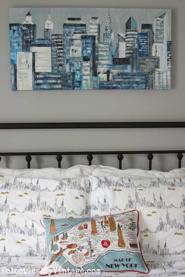 Love this gray paint color and the New York City themed art, sheets and pillow! kellyelko.com