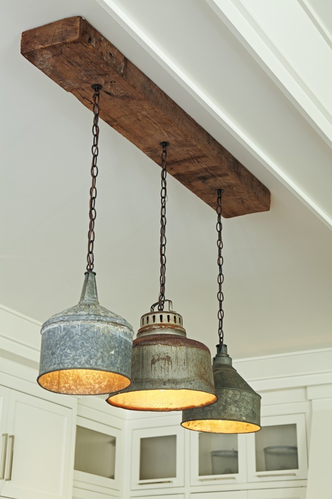 Salvaged tractor funnel chandelier - love the rustic wood kellyelko.com