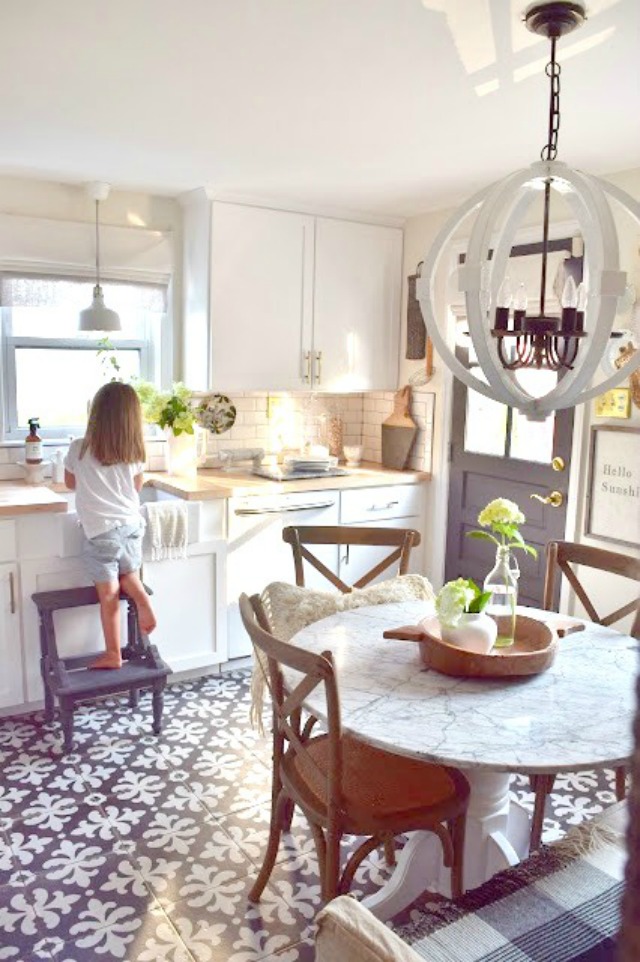 Eclectic Home Tour of Nesting with Grace - love this vintage/modern kitchen and those beautiful graphic tiles kellyelko.com