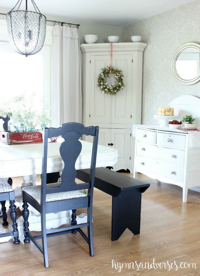 Love this eclectic dining room with painted furniture, blue chairs and old bench kellyelko.com