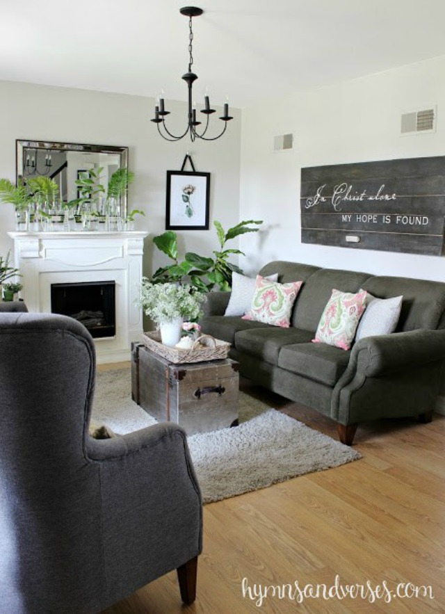 Living room with gray sofa and chairs - love the reclaimed wood sign kellyelko.com