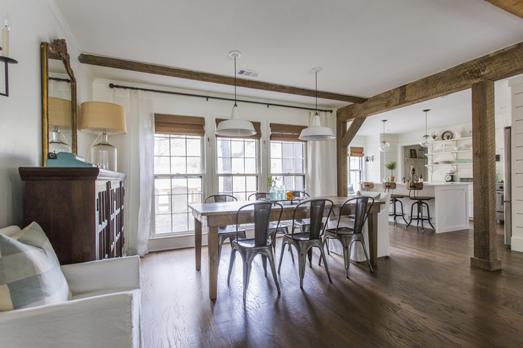 Love this open floor plan with big farmhouse table, metal chairs and enamel pendant lights kellyelko.com