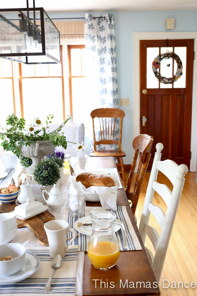 Farmhouse dining room - love the mismatched chairs and industrial chandelier kellyelko.com