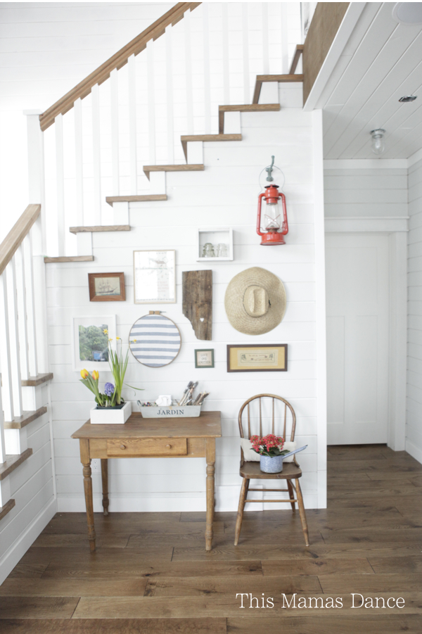 Farmhouse foyer gallery wall - love the mix of art and unique finds kellyelko.com