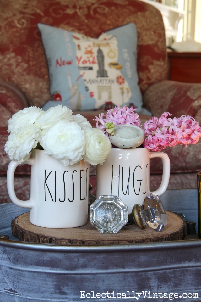 Simple Valentines Day -  how cute are these Valentine hugs and kisses mugs holding spring flowers kellyelko.com