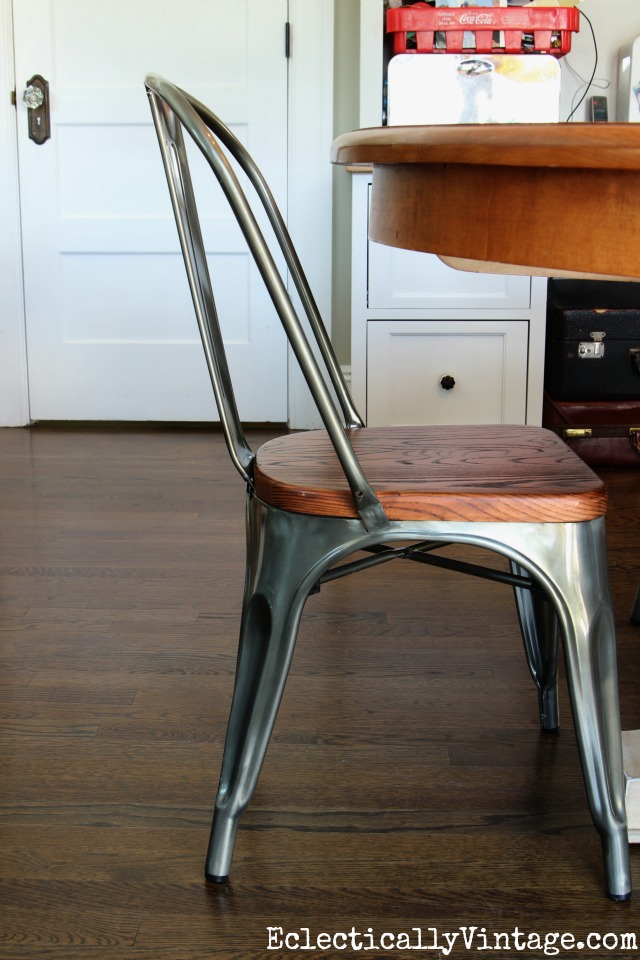 Love this metal and wood industrial dining chair! The wood really warms it up kellyelko.com