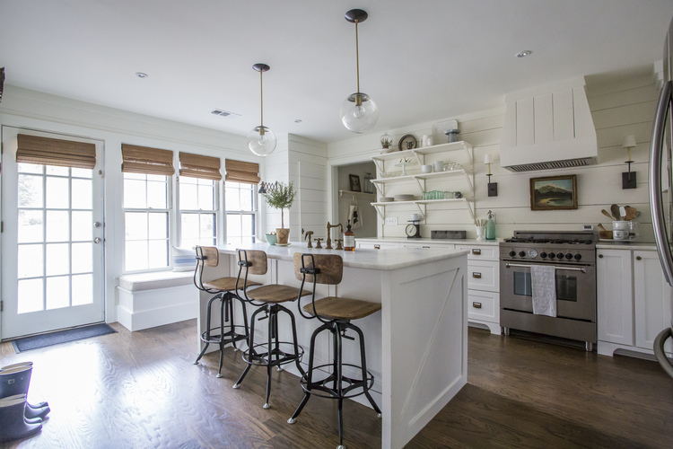 Love all the details in this white kitchen - the shiplap walls, open shelves, glass lighting and industrial barstools kellyelko.com