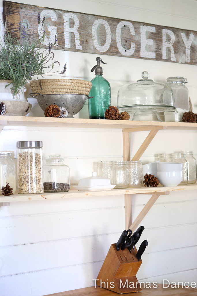 Open kitchen shelves and love the rustic wood grocery sign kellyelko.com